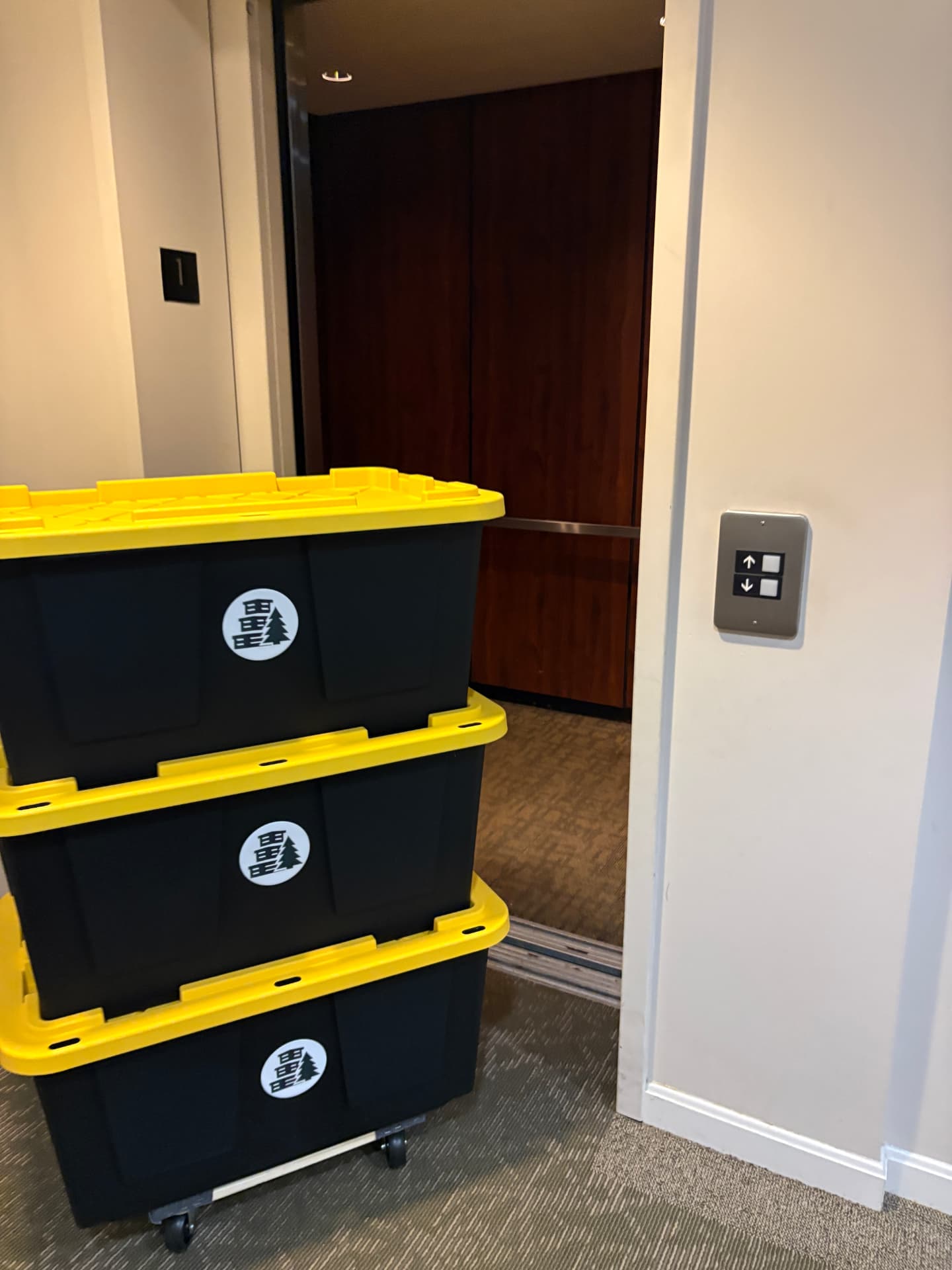 Maine Moving Totes on a moving dolly entering an elevator